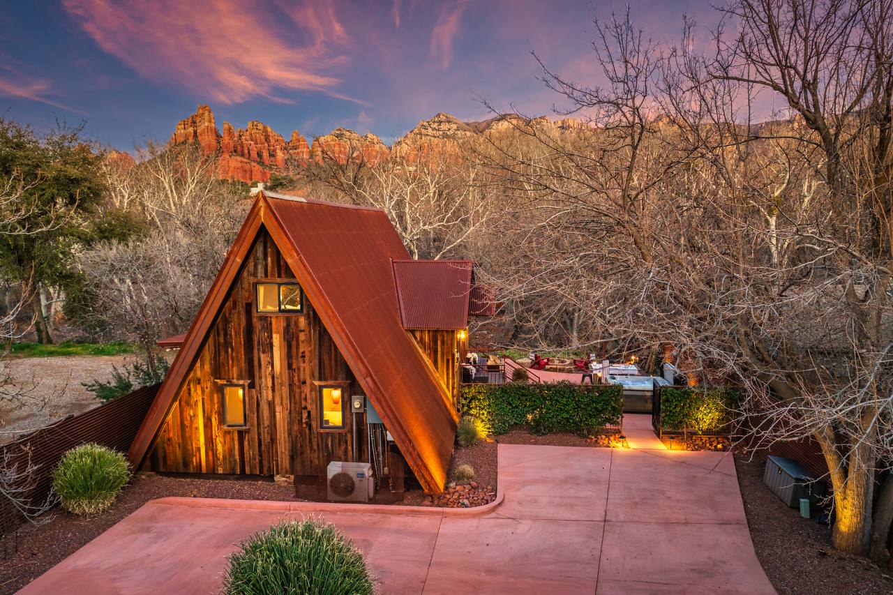 Creekside 88 A-frame lit up at dusk