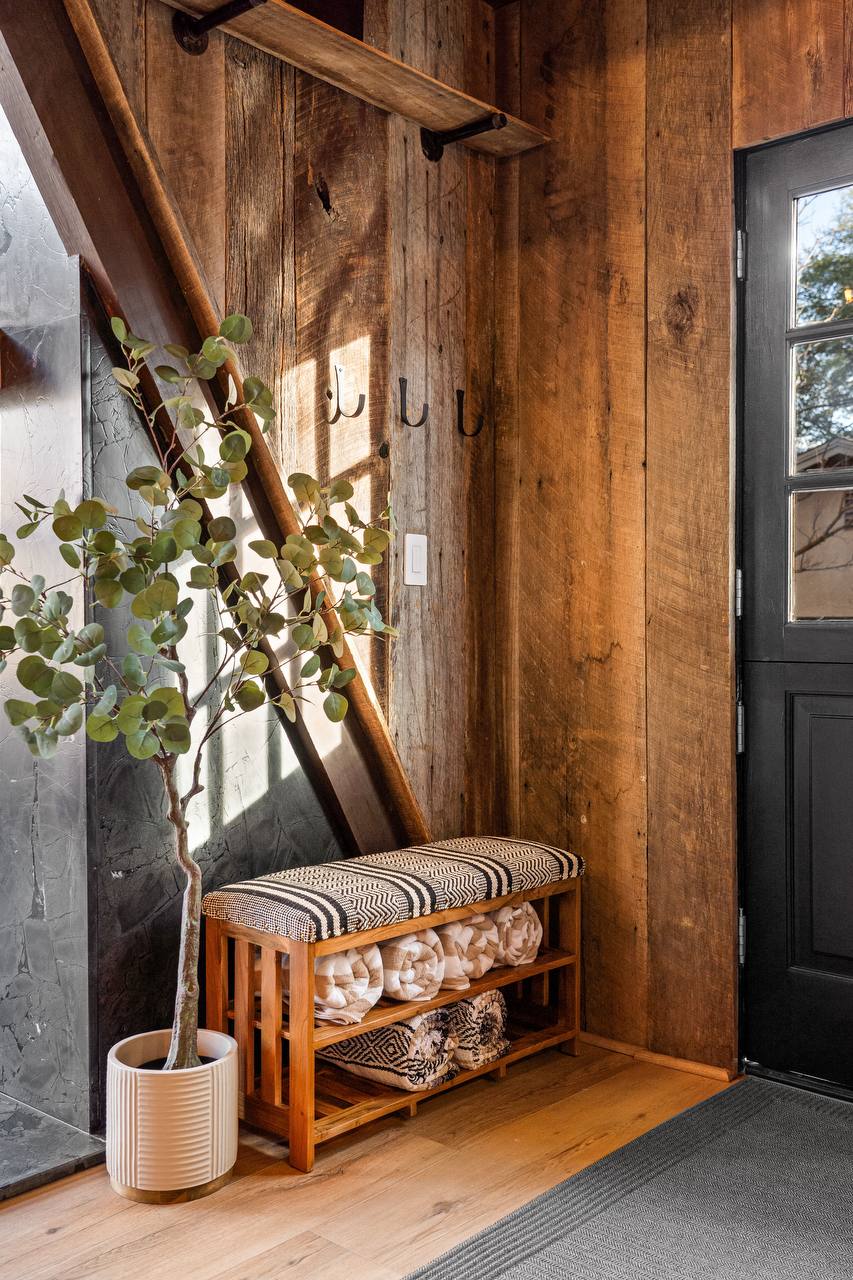 Entryway with reclaimed wood and cozy bench