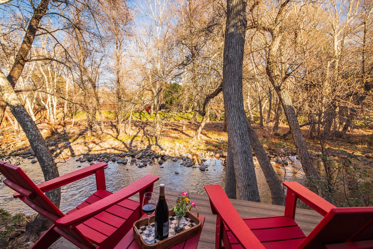 Creek deck with wine overlooking Oak Creek