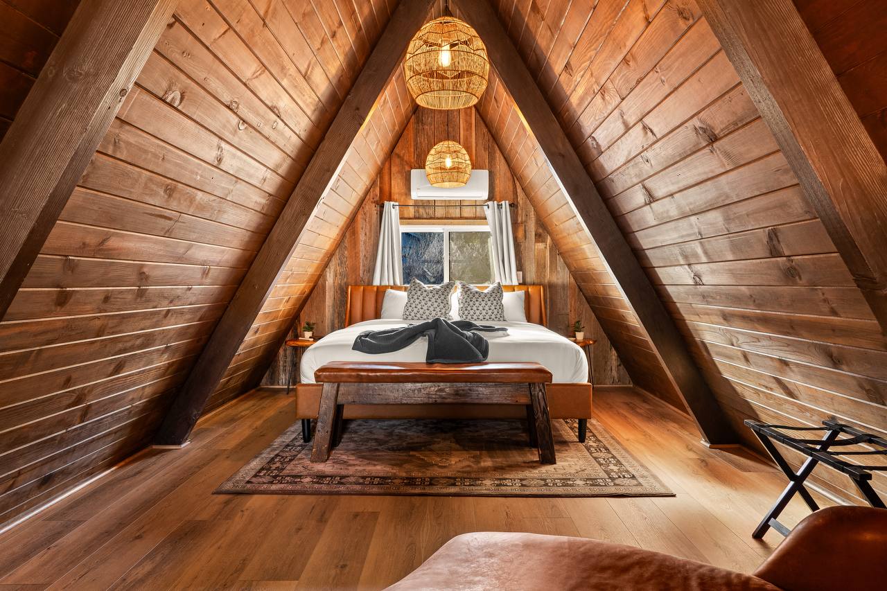 Loft bedroom with woven pendant lights